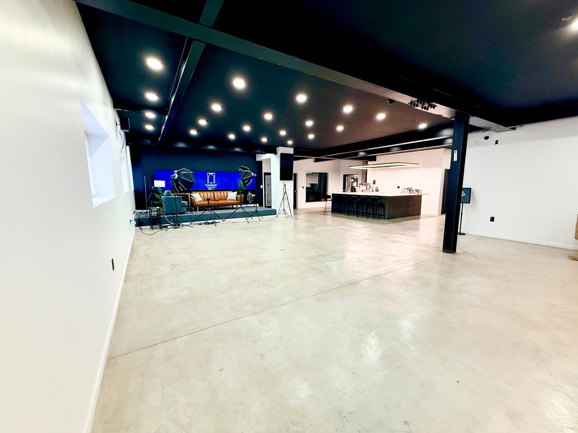 The main hall at 6 Arc Place — a wide, empty polished-concrete floor with high ceilings, the space NEXGEN programmes run in.